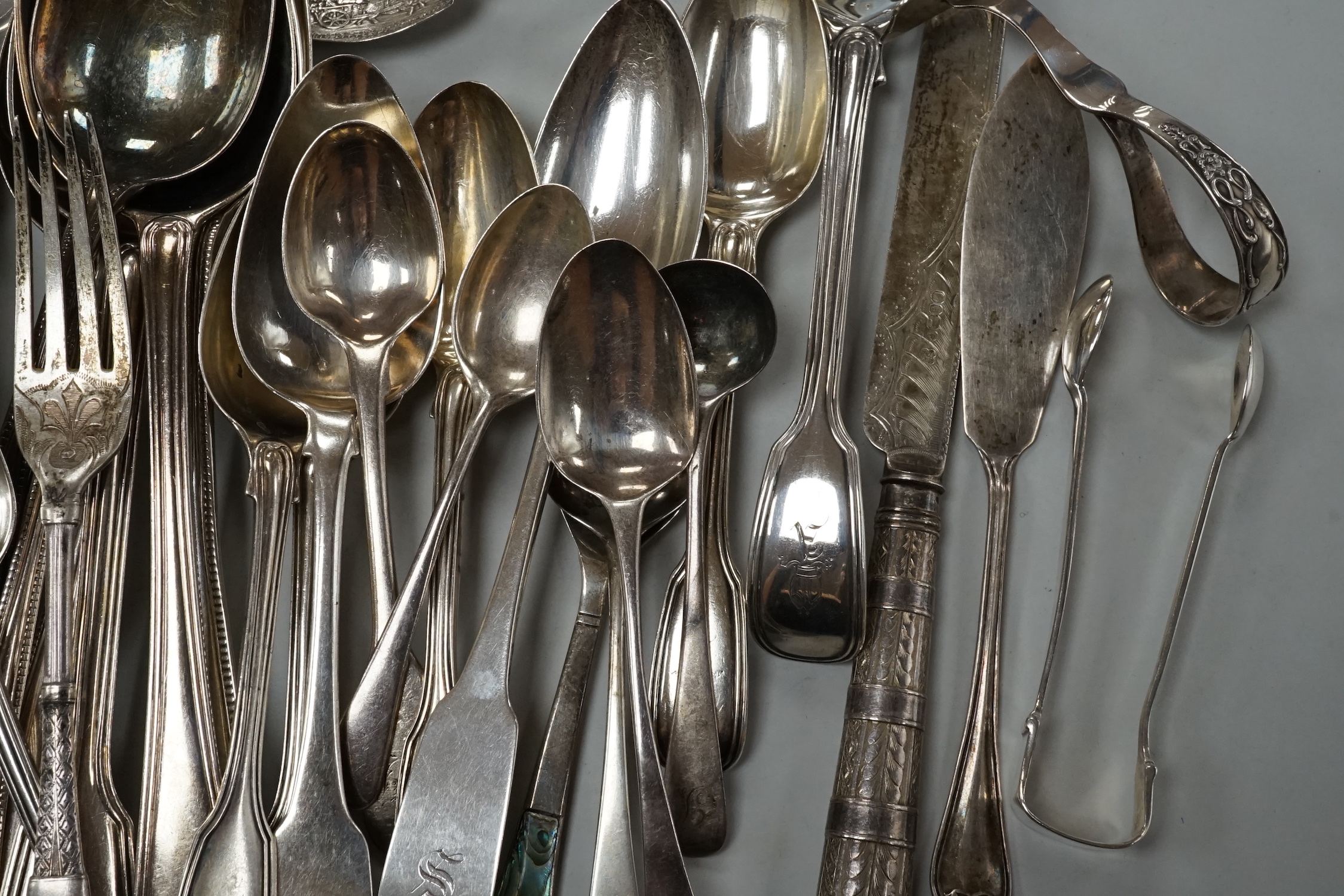 A quantity of assorted mainly 19th century and later silver flatware, various date and makers including three cased sets, 37.5oz.